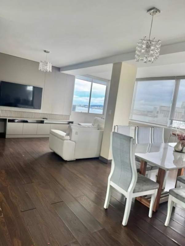 Modern living dining room with large windows city skyline in PH Plaza Paitilla Panama City