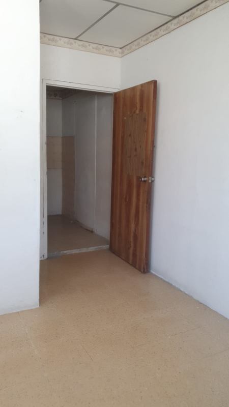 Simple bathroom with walk-in shower, sink, toilet Los Andes rental Panama