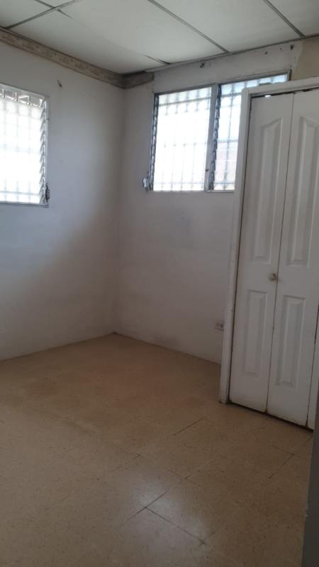 Empty interior room with security barred windows tiled floor Los Andes Panama