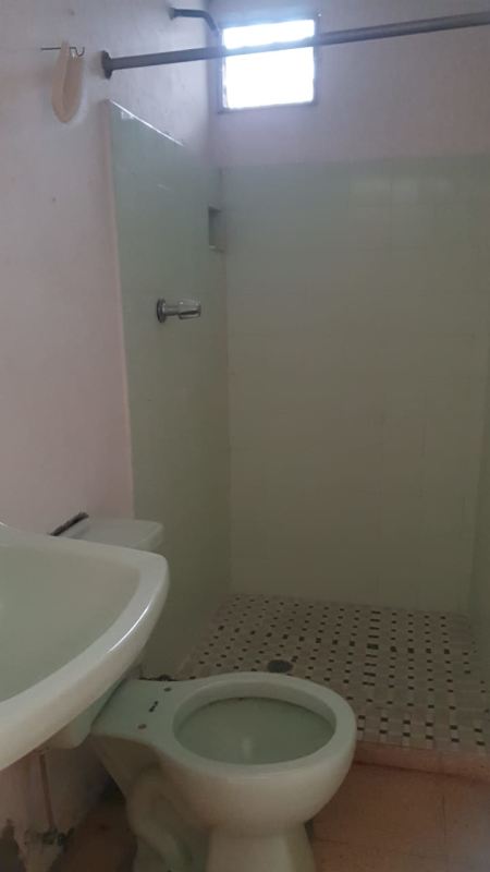 Bedroom with barred dual windows, closet doors, tiled floor Los Andes Panama