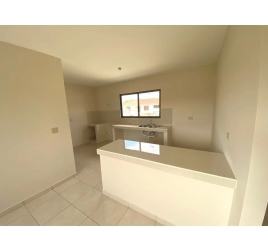 Interior hallway with white tiles and recessed lighting in Residencial Piamonte David Panama