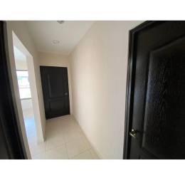 Hallway with tile flooring, black doors, white walls in Residencial Piamonte David Panama
