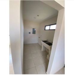 Simple kitchen with breakfast bar and window in Residencial Piamonte David Chiriquí