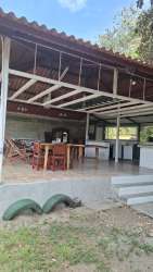 Covered patio area with tiled roof and outdoor dining in San Carlos beach property