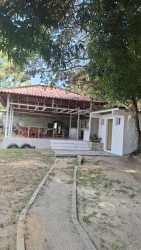 One-story white beach house with front porch in Costa Esmeralda Panama