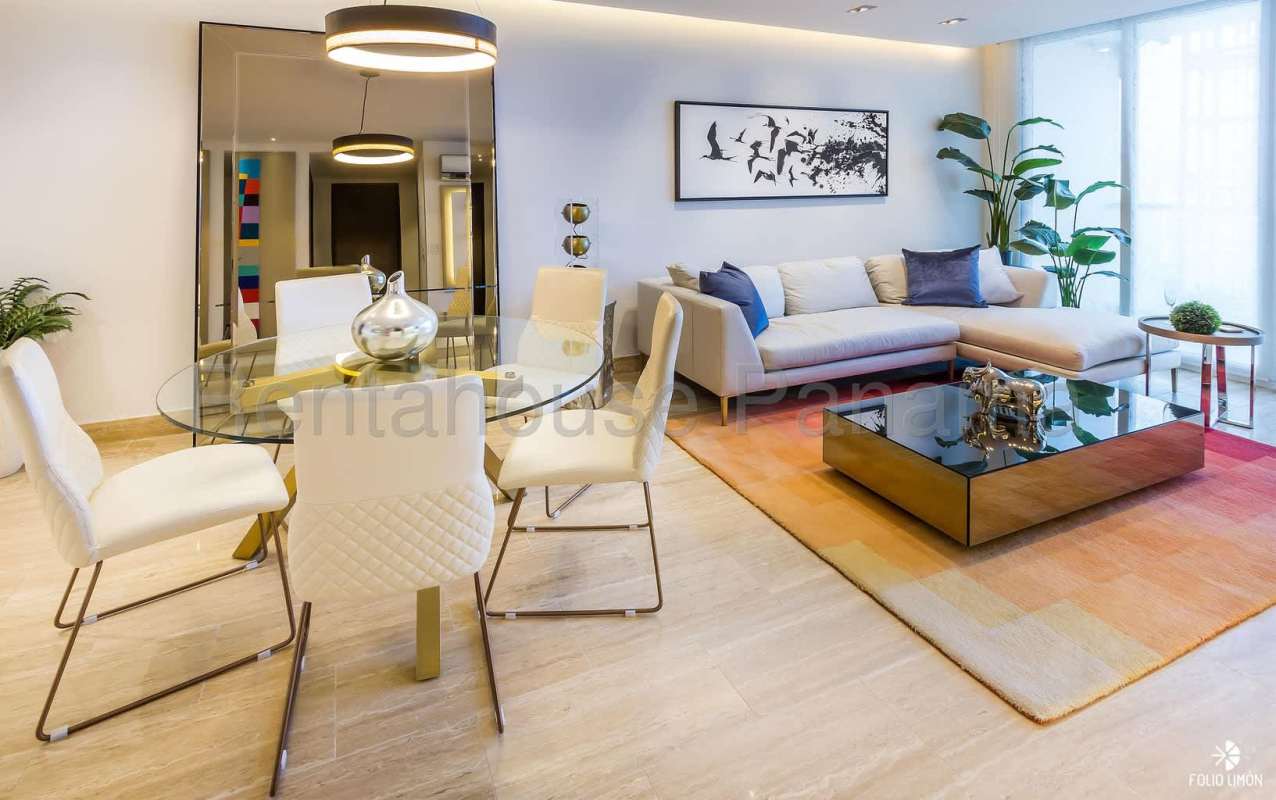 Bright modern living dining room with large windows ocean view at PH Pacific Point Costa del Este Panama