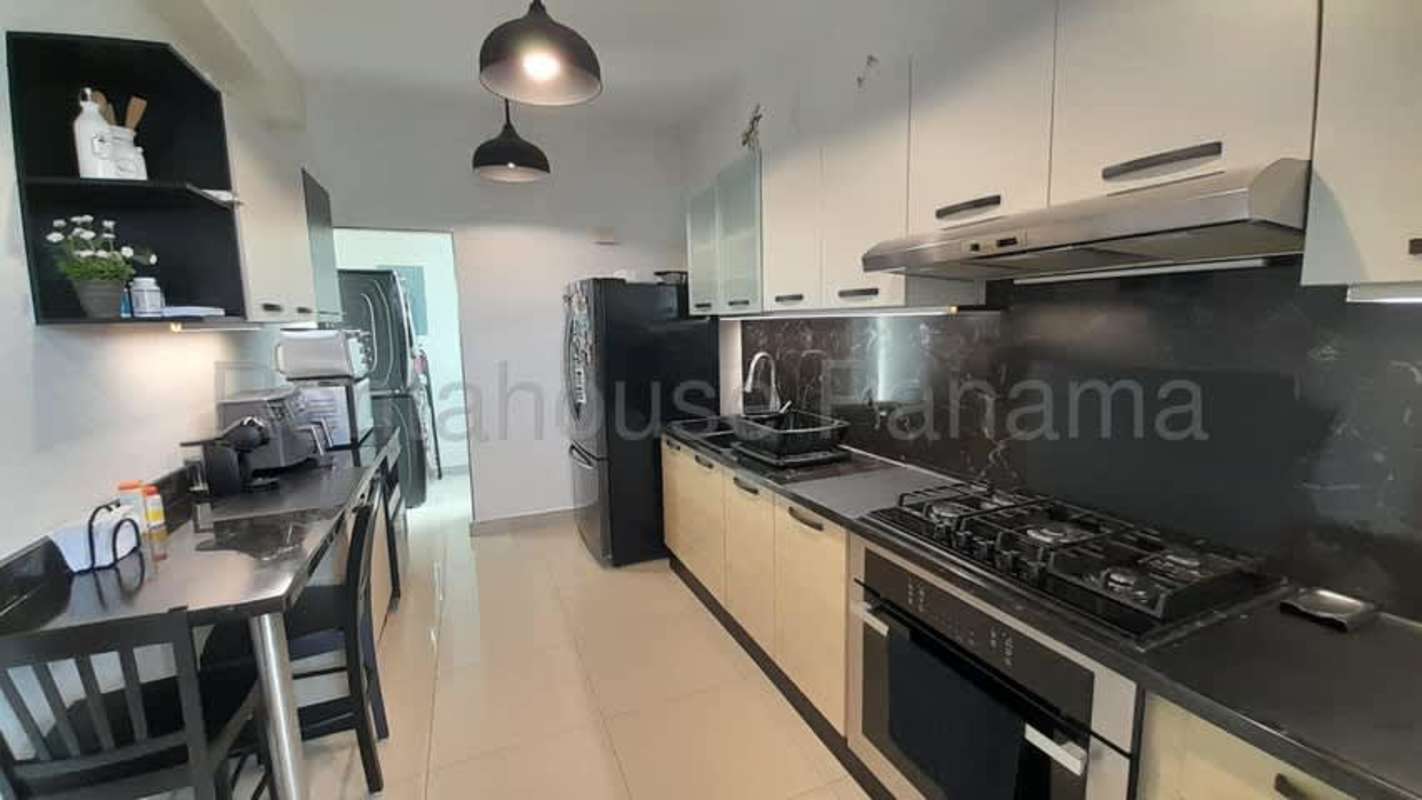 Closed kitchen with granite countertops stainless appliances PH Destiny Tower San Francisco Panama