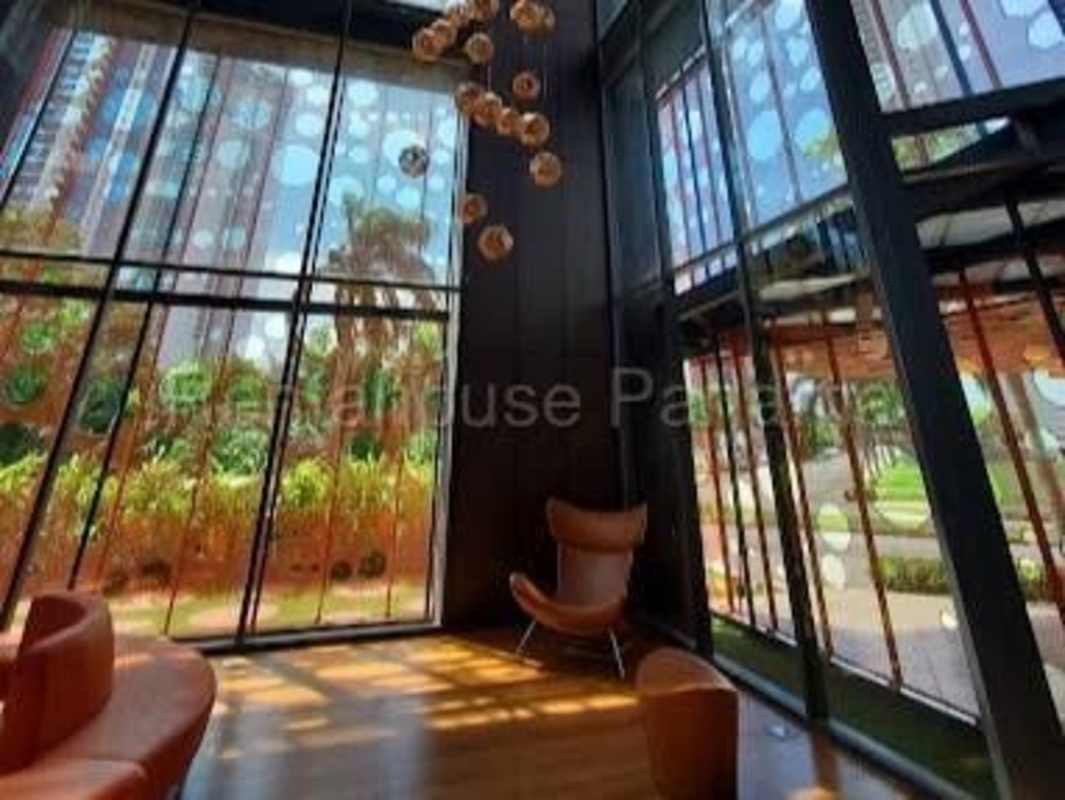 Modern lobby with orange sofas and floor-to-ceiling glass windows PH Paramount Costa del Este