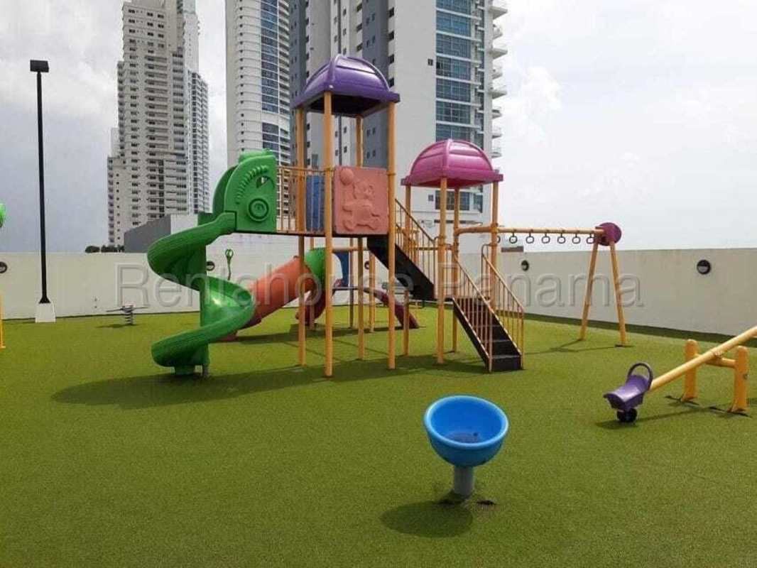 Rooftop recreational area with soccer net, trampoline, and city view PH Paramount Panama