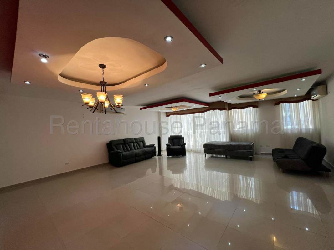 Kitchen with granite countertops and wood cabinetry Apartment Obarrio Panama