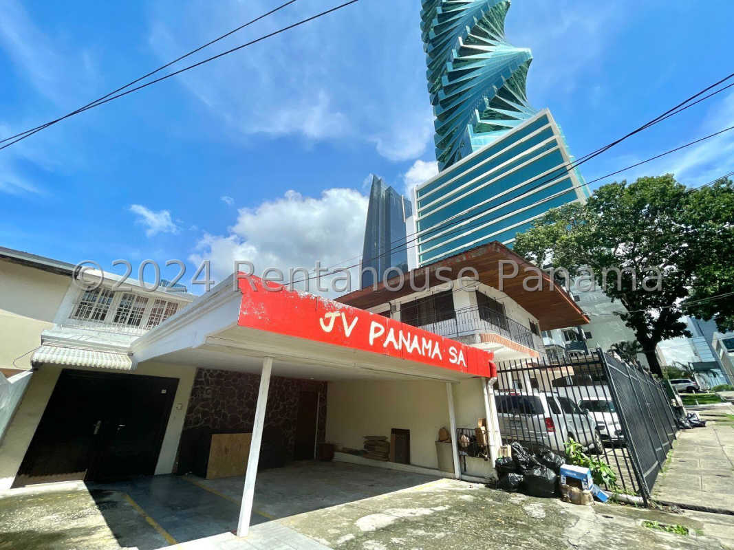 Multi-level commercial property facade beside iconic Tornillo tower in Obarrio Panama