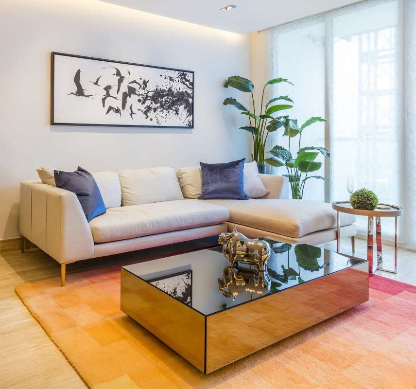 Spacious living room with ocean view balcony, floor-to-ceiling windows, modern furnishings in PH Grand Tower Costa del Este Panama City