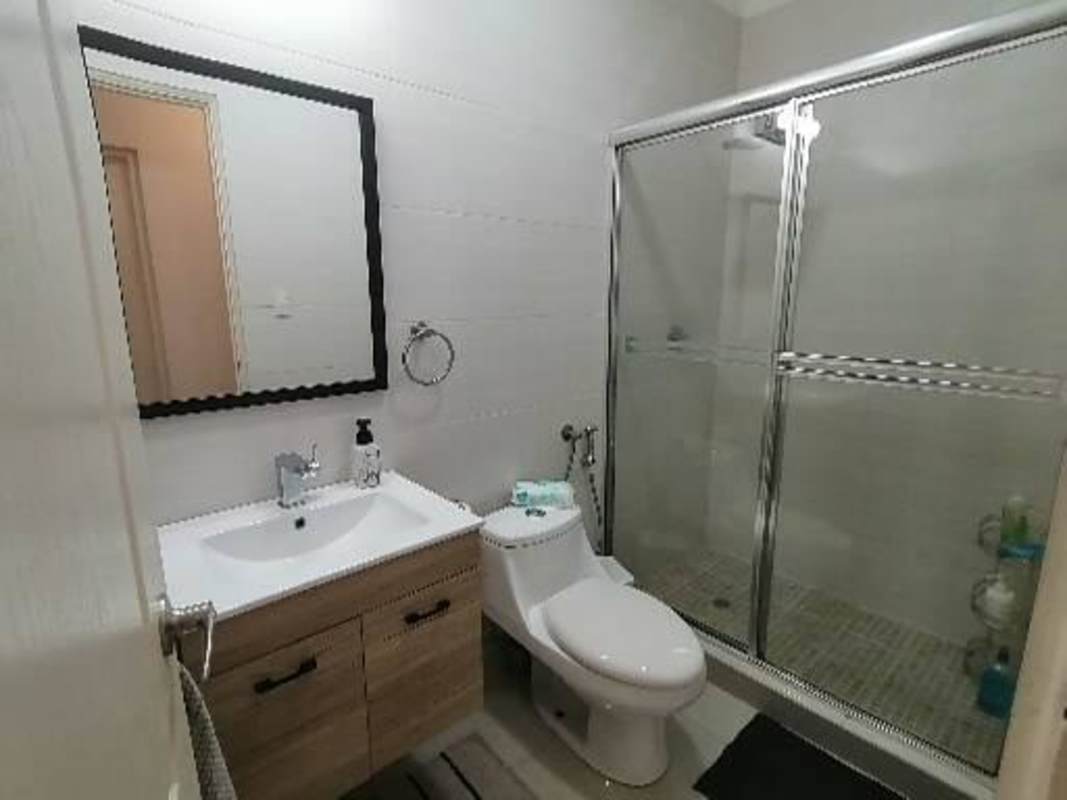 Bathroom with glass shower, modern vanity in PH Cangrejo Bay Panama City
