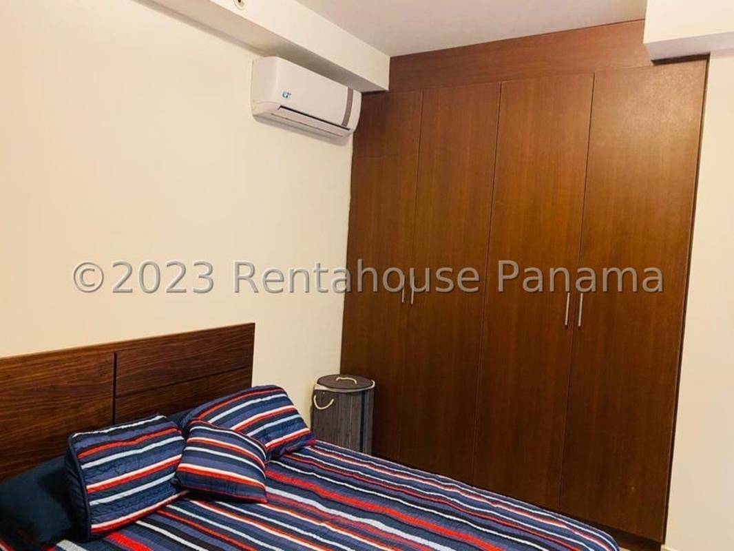 Master bedroom featuring built-in closet, ensuite bathroom, tiled floors in PH Cangrejo Bay El Cangrejo Panama