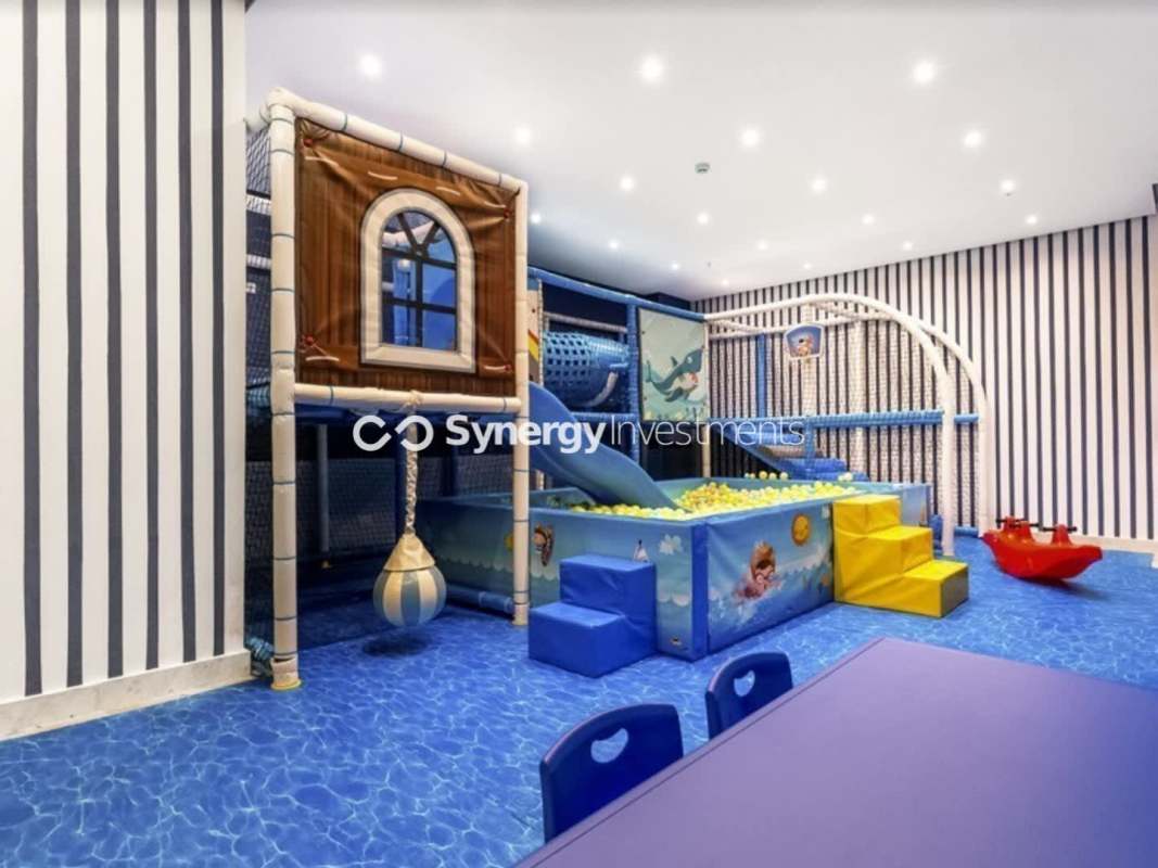 Bright living room with floor-to-ceiling windows Panama City PH Metropolitan