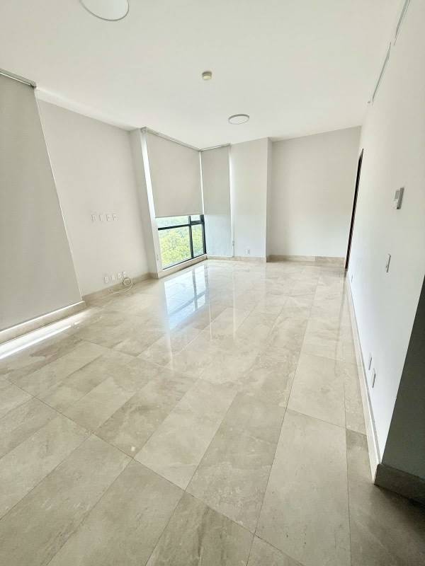 Spacious living room with marble floors and large windows at PH Mansion One Santa María Panama City