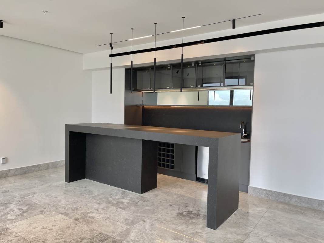 Luxury kitchen with marble tops, island counter, integrated appliances in Santa María apartment