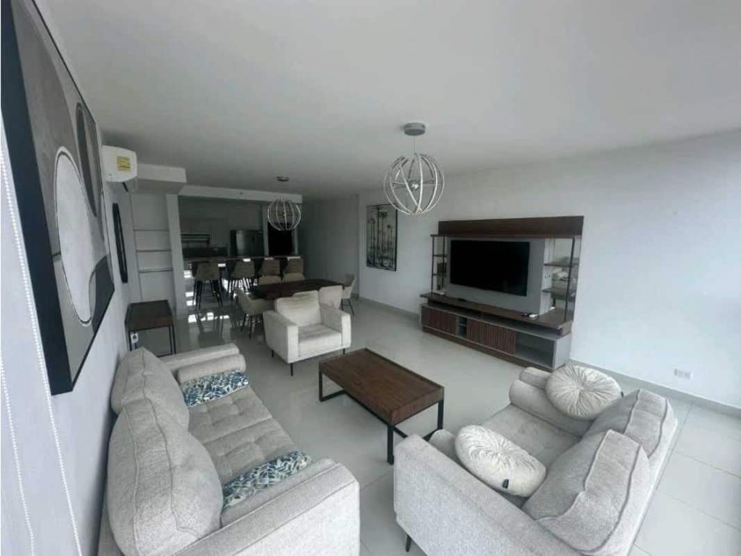 Modern living dining room with large windows and city view in Costa del Este apartment PH Top Towers Panama