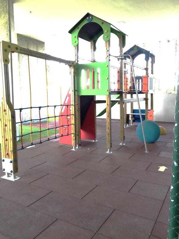 Indoor children's playground with wooden climbing structure rope net slide PH Oceana Panama