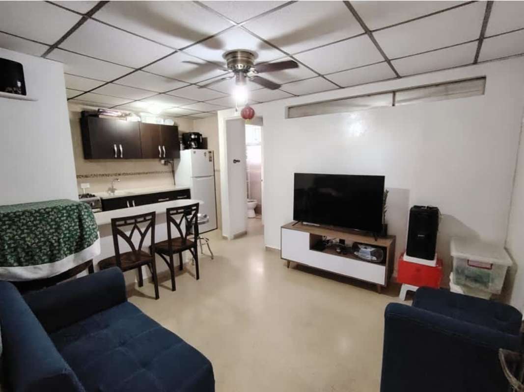 Furnished living area with sofas, ceiling fan, open kitchen PH Beverly Plaza Panama