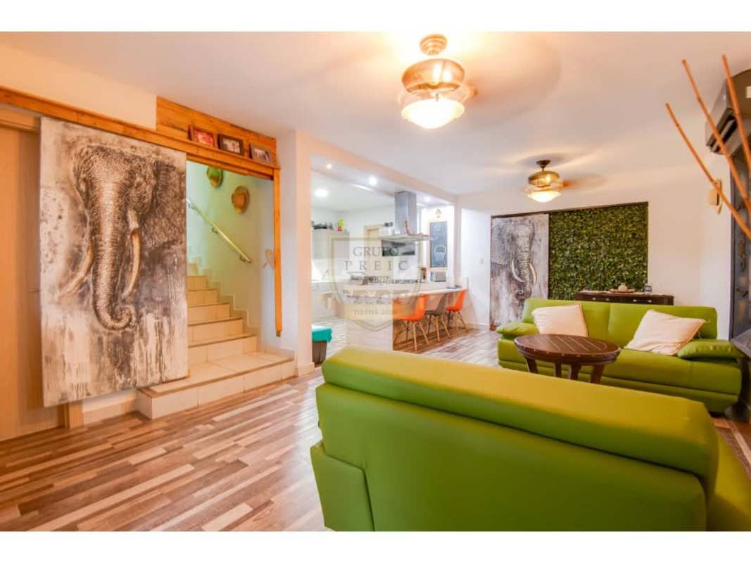 Kitchen with island, gas stovetop, hanging spice rack in PH Victoria Paseo del Norte Brisas del Golf