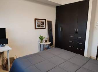 Bright bedroom with large window and closet in PH Midrise Panama Pacifico apartment for sale