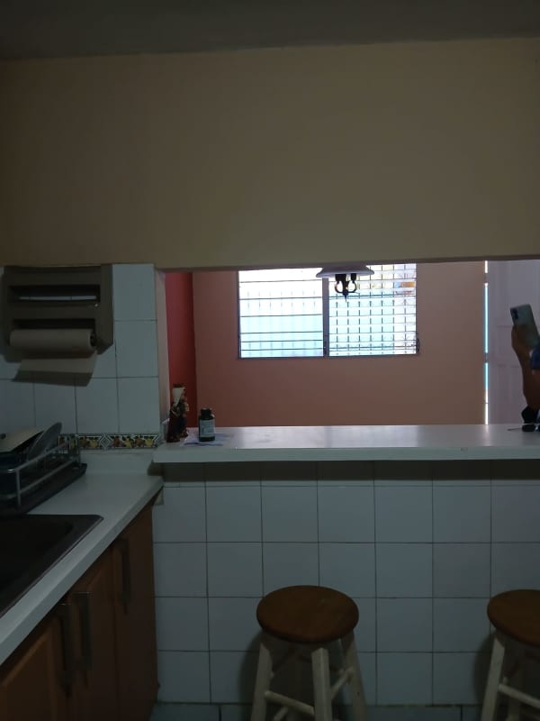 Kitchen interior with breakfast bar stools ceramic tile backsplash Condado del Rey Panama