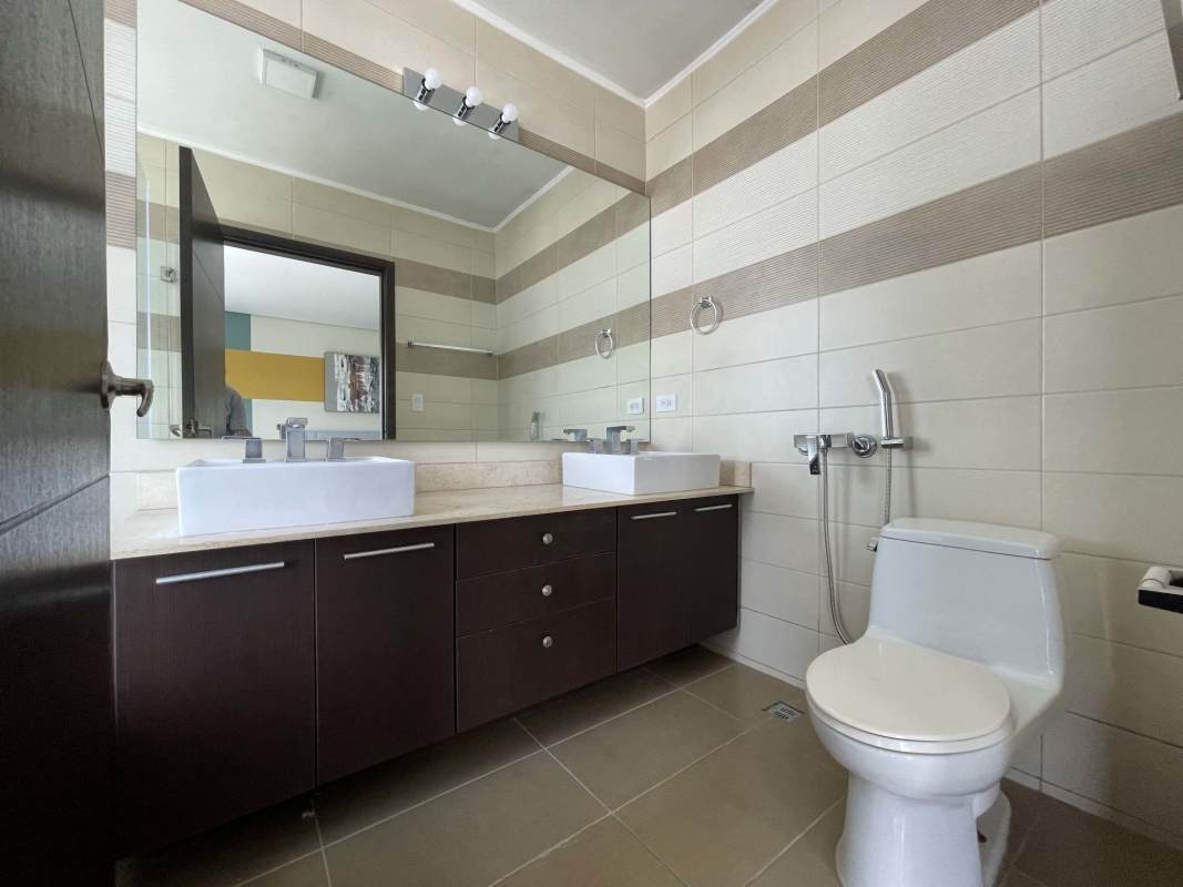 Contemporary kitchen with granite countertops and laundry appliances in PH Country Club Costa del Este Panama City