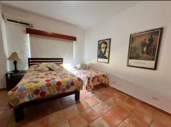 Bright master bedroom with AC, king bed and large windows facing ocean in Punta Chame