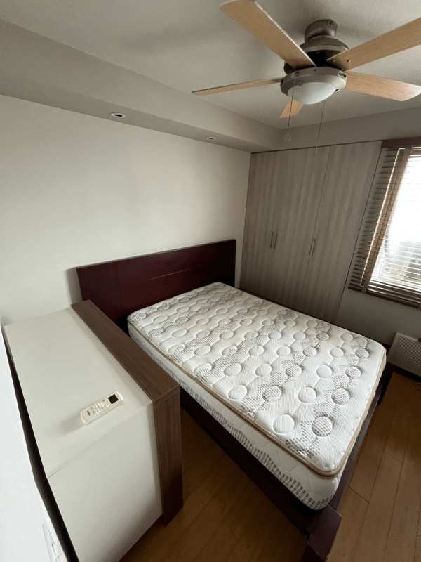 Compact bathroom with glass shower enclosure modern vanity in PH Pacific Wind Panama City