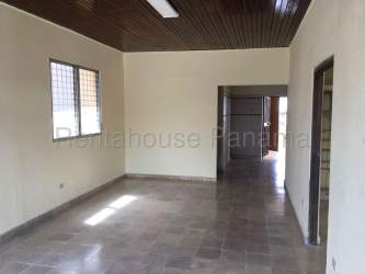 Interior open area of commercial retail space with tiled floors fluorescent lighting in La Chorrera Panama