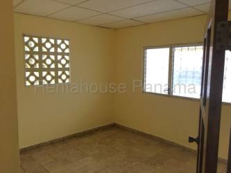 Exterior of gift shop with signage floral decorations and glass door La Chorrera Panama