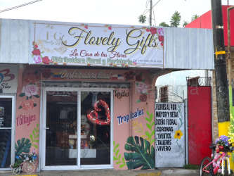 Flower gift shop exterior with signage and floral decorations on storefront glass La Chorrera Panama