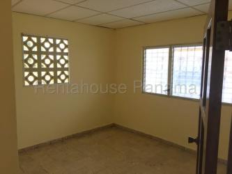 Room with window bars ventilation blocks tile floor drop ceiling in commercial property La Chorrera Panama