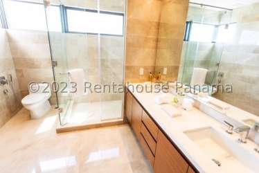 Luxury bathroom with double vanity and glass shower at Santa Maria Golf Panama City
