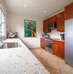 Second bedroom in Boquete furnished condo with double bed, closet, mountain view