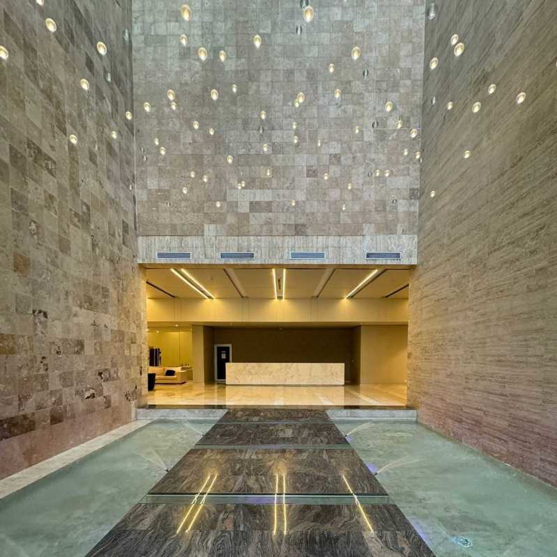 Spacious lobby with contemporary seating, lighting and marble floors in PH Lumiere Panama