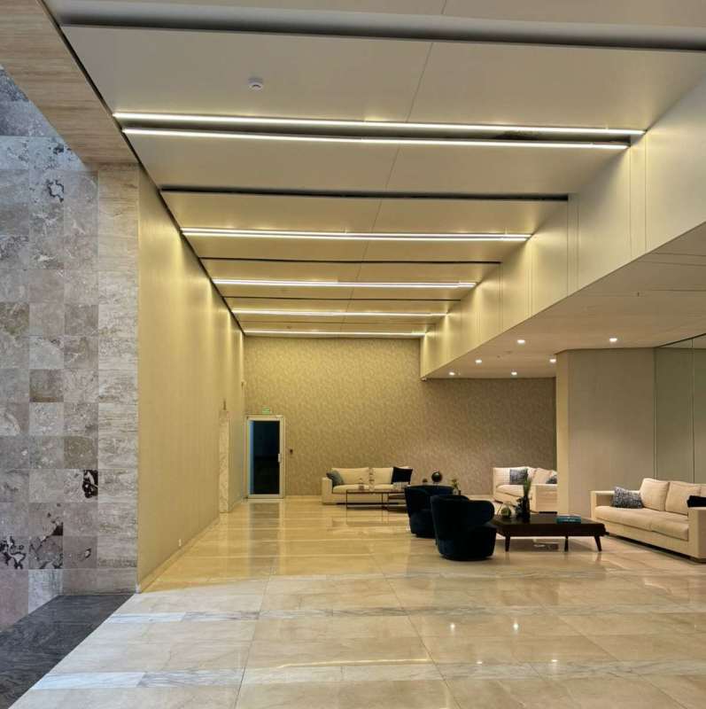 Minimalist lobby style with marble floors and reception PH Lumiere Costa del Este Panama