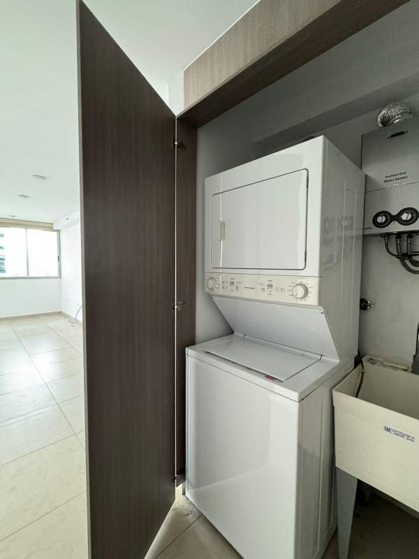 Laundry closet setup with utility sink and hookups in PH Lumiere Costa del Este