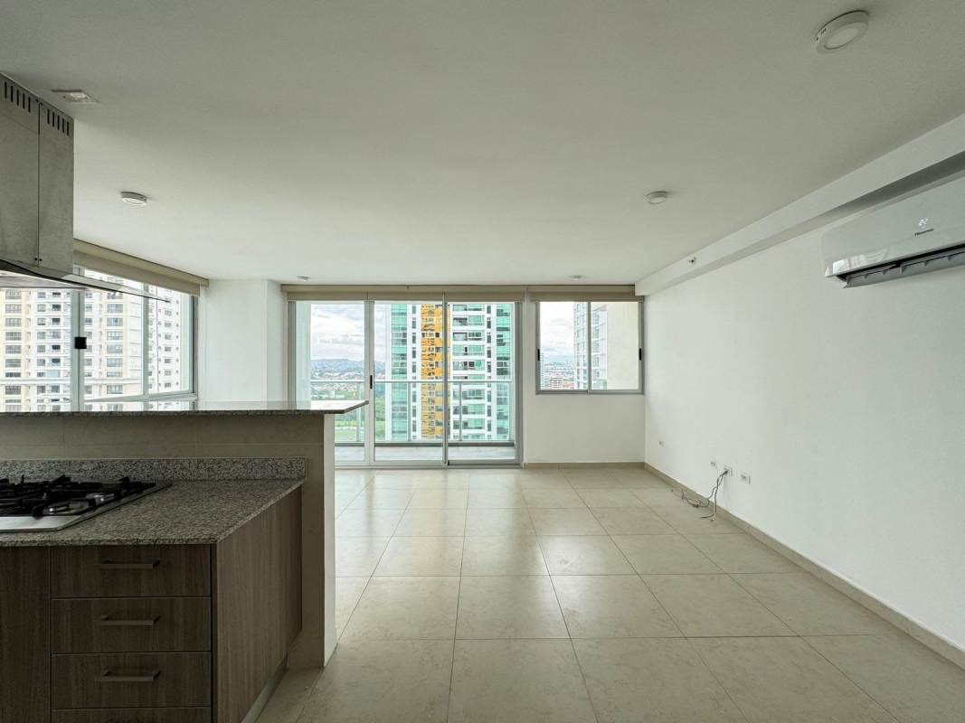Open concept living room and kitchen with natural light in PH Lumiere Costa del Este rental