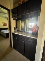 Covered terrace overlooking fenced backyard, furnished house rent David Chiriquí