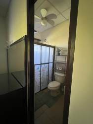 Contemporary kitchen with granite counters, cabinets, appliances in rented house David Chiriquí