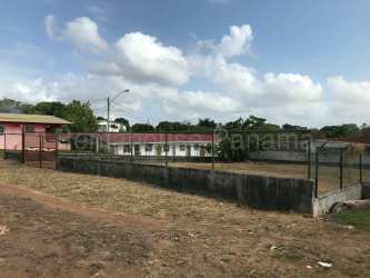 Corner vacant fenced lot with dirt road access in Panama Pacifico La Chorrera