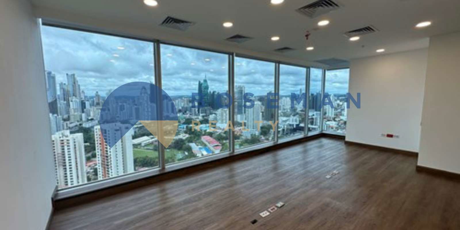 High-speed elevators lobby with glossy black floors and white walls at Oceania Business Plaza Panama City