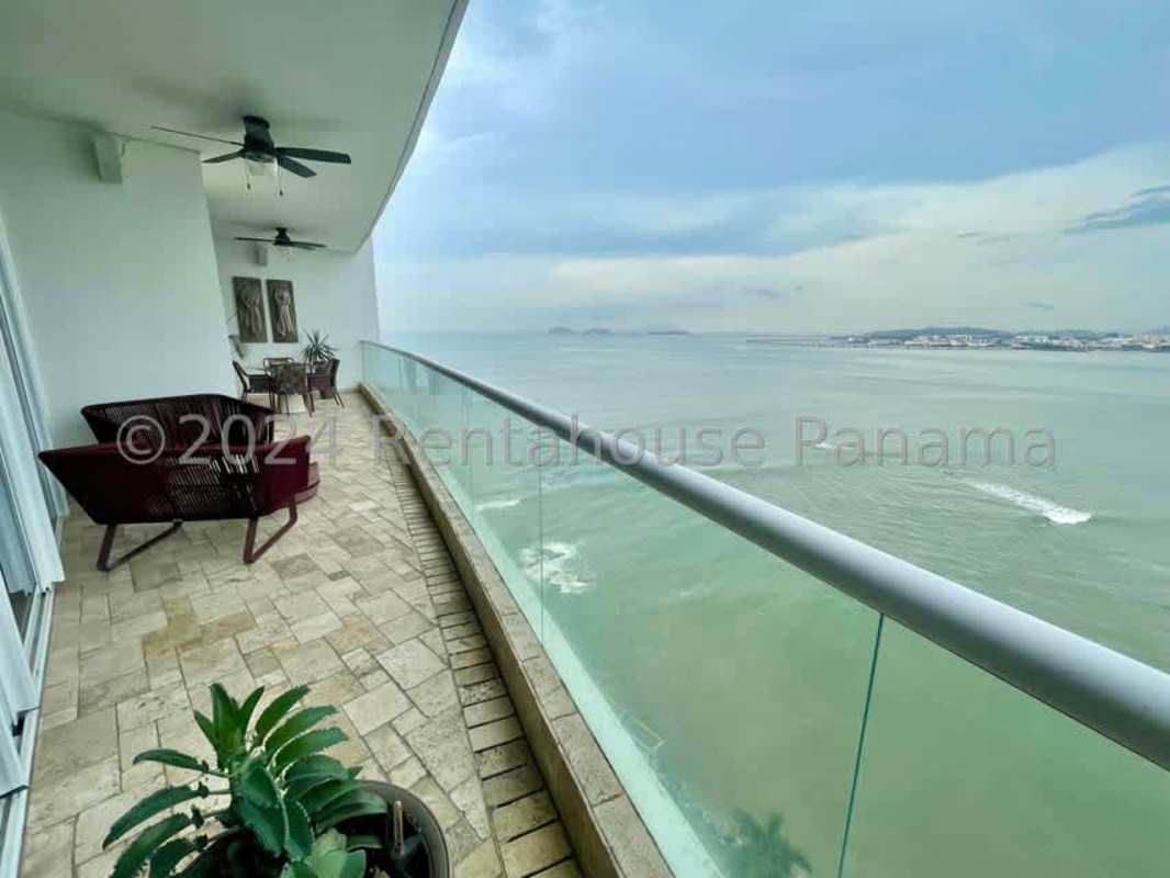 Grand entry foyer with marble floors leading to dining and living room in PH The Point, Punta Paitilla, Panama