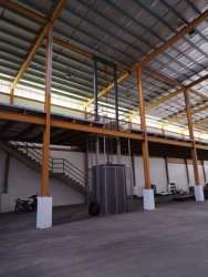 Open plan warehouse with columns and steel beams in industrial Panama