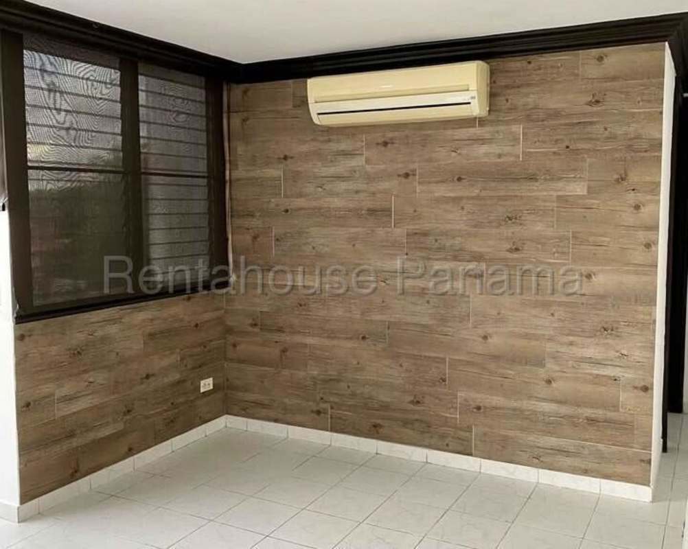 Bedroom featuring wood accent wall, windows, AC ready, Betania Panama