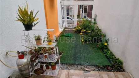 House main entrance with white gate small garden Villa Vista Alegre Arraijan