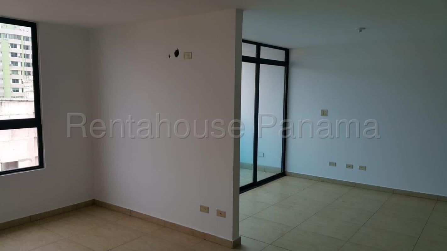 Spacious living area with large window, city view balcony access, ceramic floor, PH Condado Country Club Panama