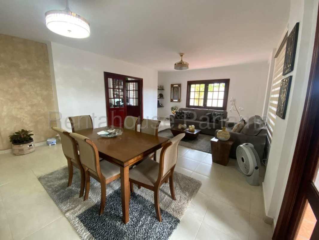 Kitchen featuring cabinets, granite countertops, appliances and ceiling fan Villa Valencia Costa Sur Panama